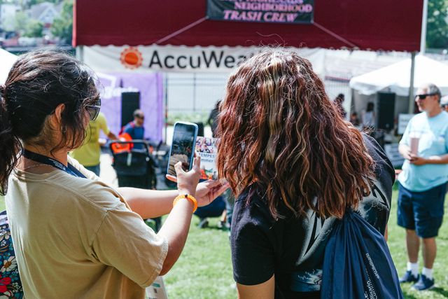 Social media campers use a cellphone for take a photo.