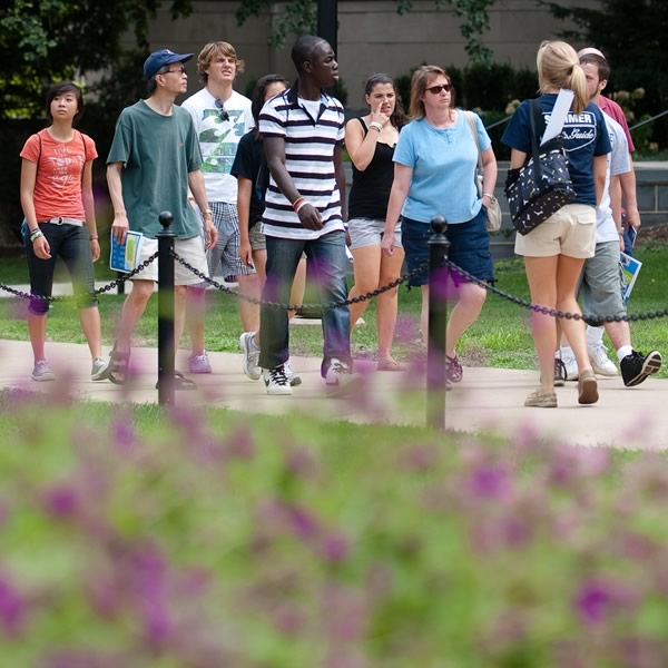 Prospective students and their families walk with a Lion Ambassador on a campus tour.