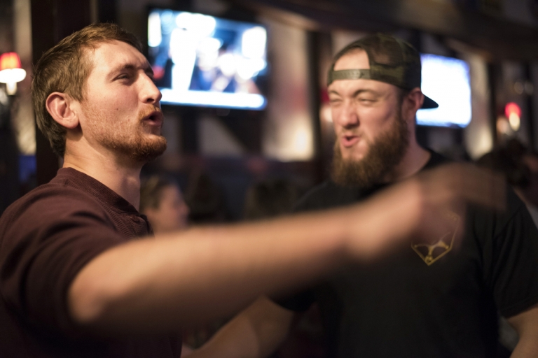 Zack ad Paul with dramatic faces as they sing along to a country song at Bill Pickles' Taproom