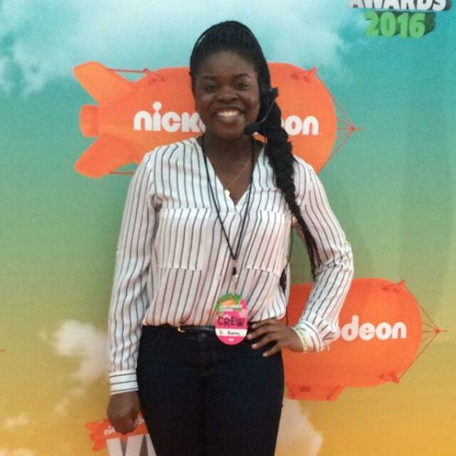Penn State Hollywood Program student Dorisa Rodney stands in front of a Nickelodeon backdrop at the Kid's Choice Awards.