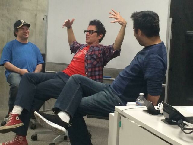 Three Hollywood professionals sit in front of a class of students.