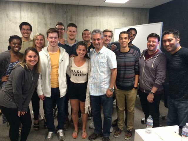 Fourteen students pose for a photo with David Shore, creator and show runner of the series, "House"