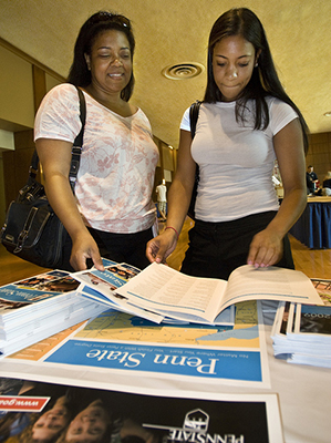 prospective student and mother reviewing information.
